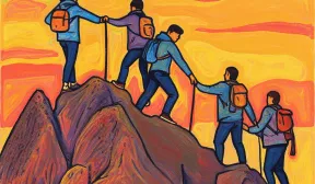 Un groupe de personnes escale une montagne.